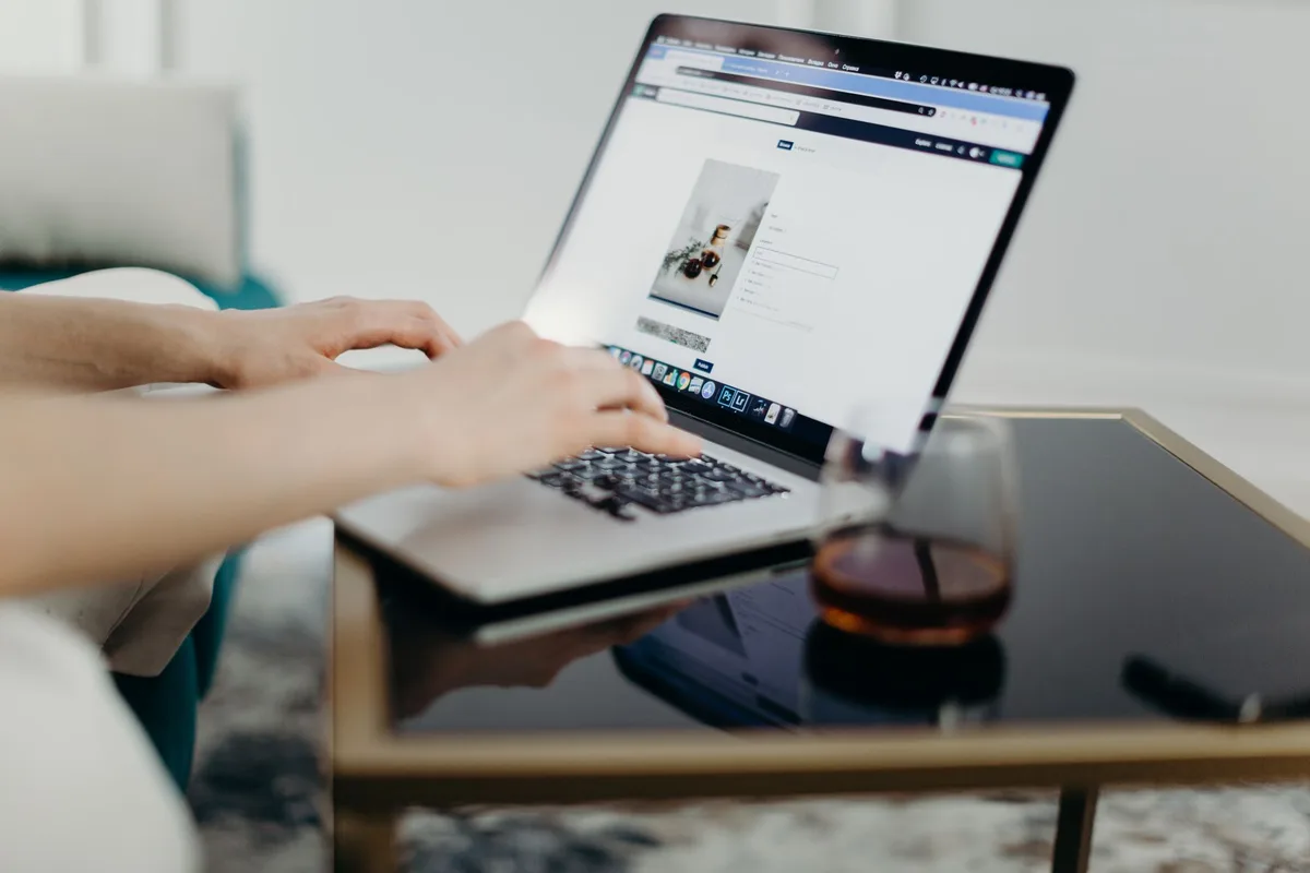 A detailed view of a person typing on a keyboard, emphasizing productivity and office work
